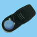 .gif of a selse 10x slide-out magnifying glass